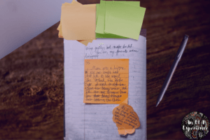 Sticky notes with a snapshot and a thoughtshot are posted on top of a draft to show how to develop ideas in writing.