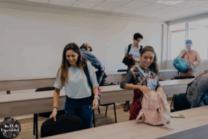 A picture of students who appear to be arriving early to class.